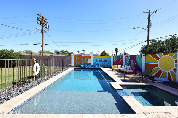 a view of a swimming pool with a lounge chair