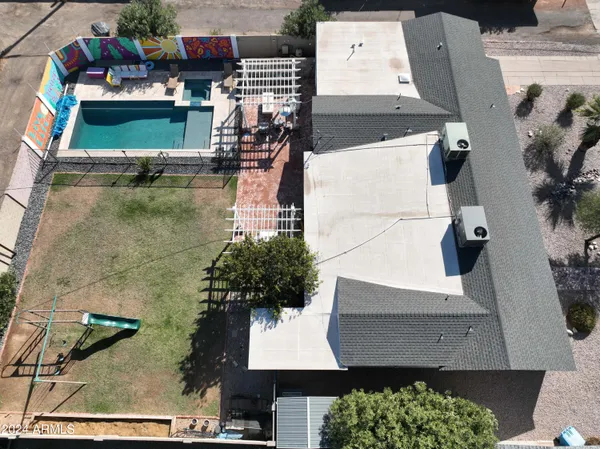an aerial view of houses with outdoor space