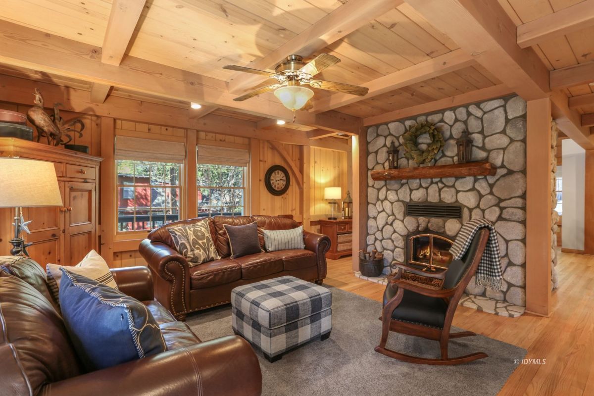 25905 Wayne Road Idyllwild, CA 92549 - Photo 14 of 47 a living room with furniture a chandelier and a large window