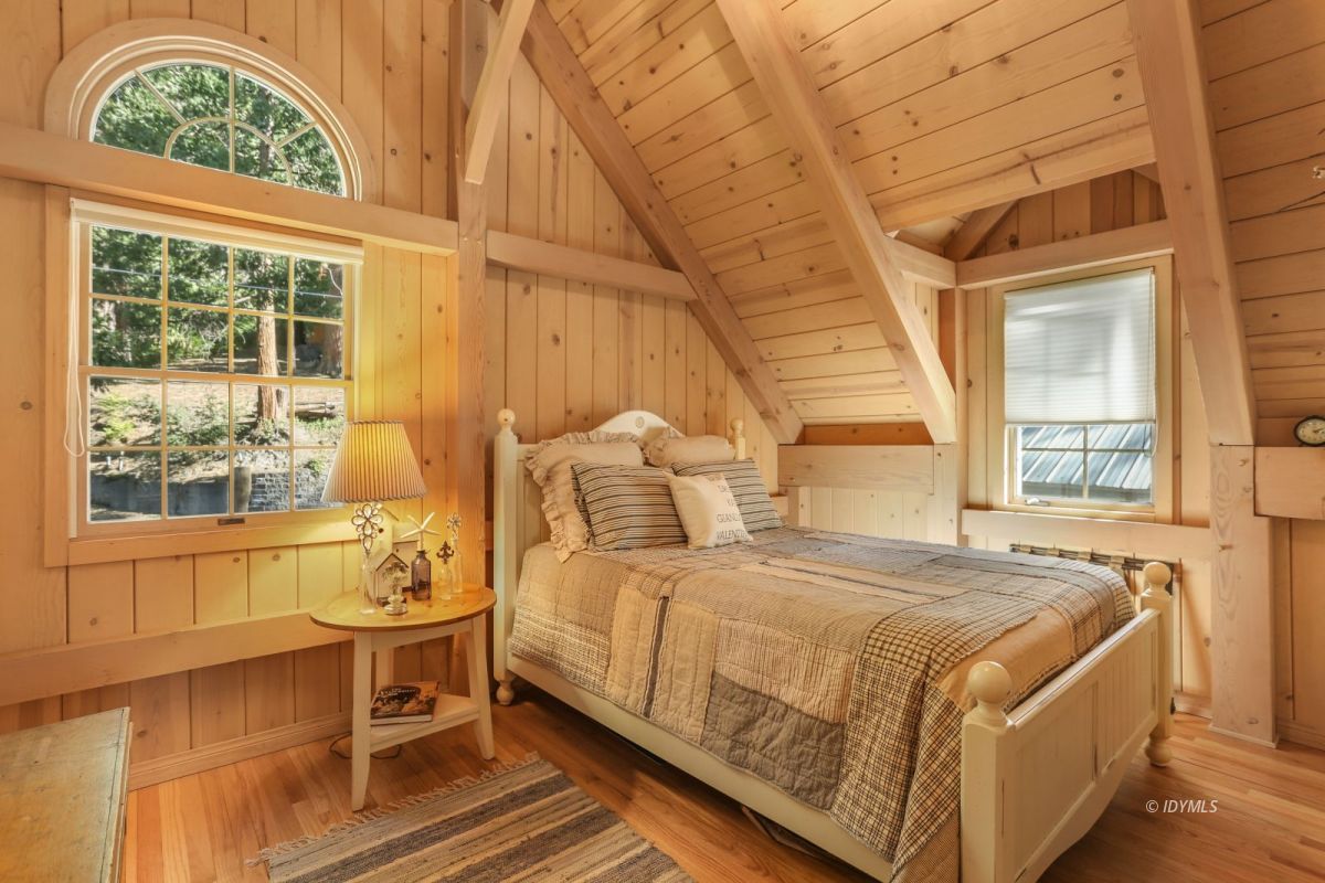 25905 Wayne Road Idyllwild, CA 92549 - Photo 22 of 47 a bedroom with a bed and windows