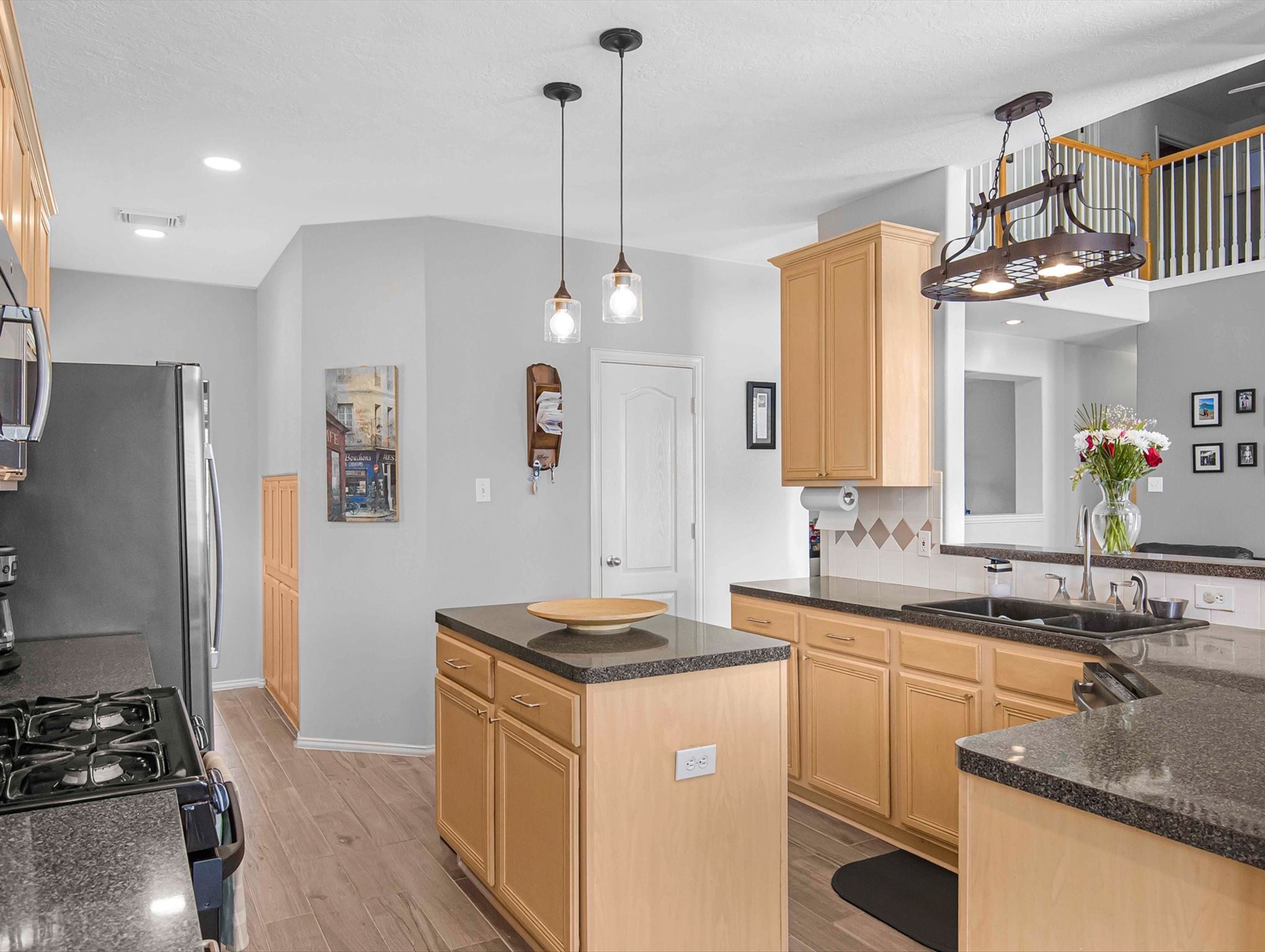21402 Hannover Forest Spring, TX 77388 - Photo 13 of 30 a kitchen that has a sink a stove and a refrigerator