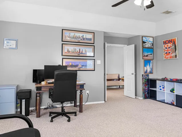 a view of a workspace with furniture and bedroom