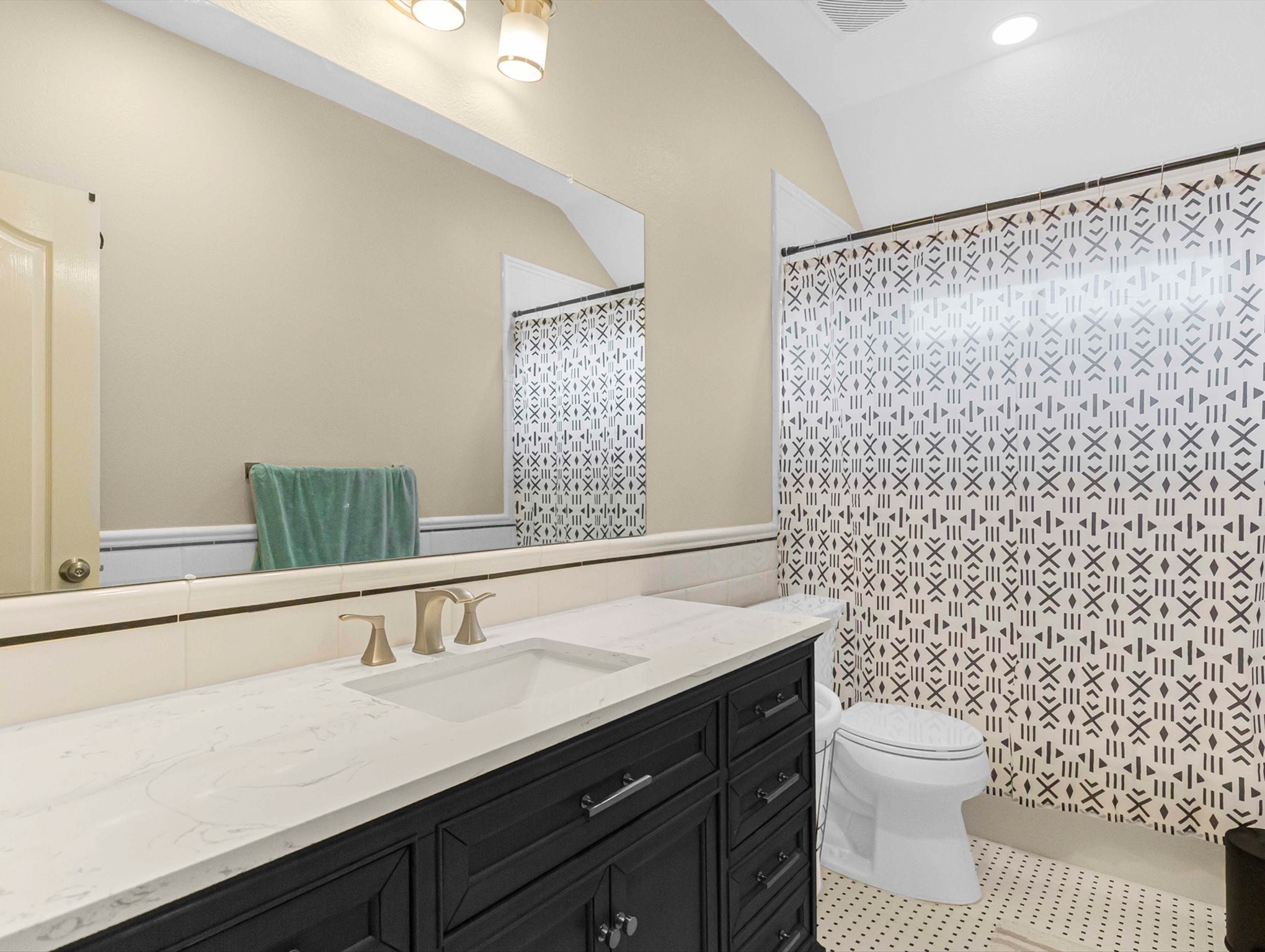 21402 Hannover Forest Spring, TX 77388 - Photo 24 of 30 a bathroom with a granite countertop sink a toilet and a mirror