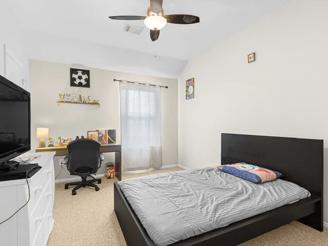 a bedroom with a bed and furniture