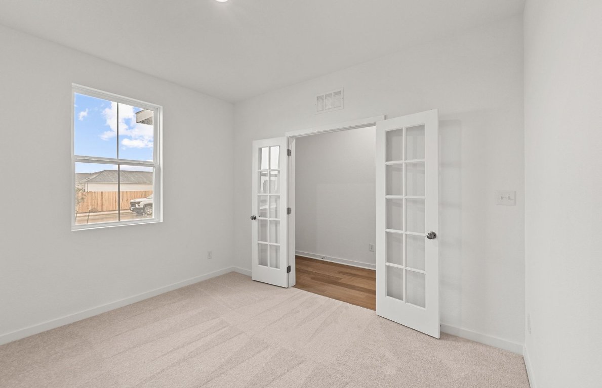 325 Sullivan Way Elgin, TX 78621 - Photo 12 of 19 an empty room with windows