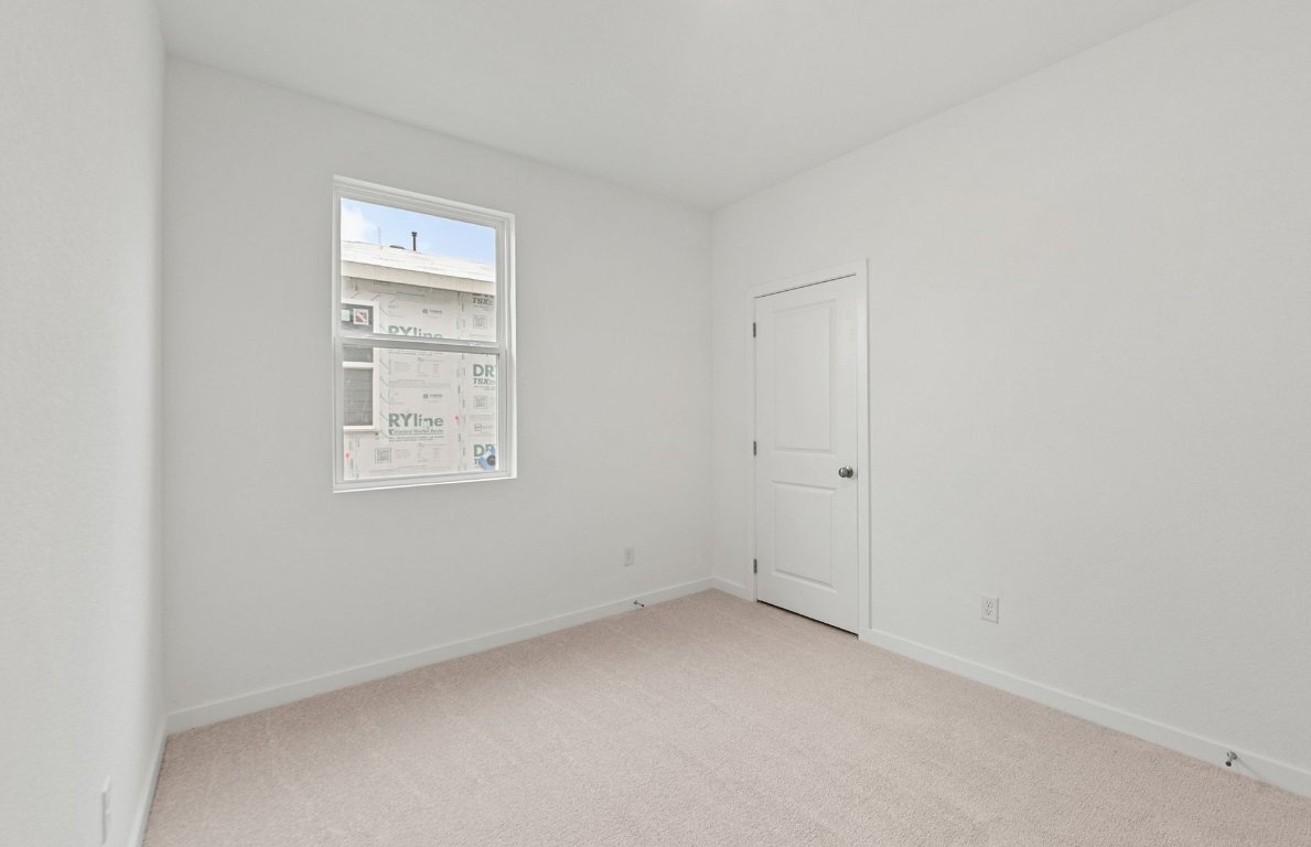 325 Sullivan Way Elgin, TX 78621 - Photo 14 of 19 an empty room with windows