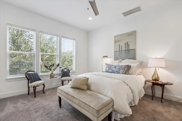 a bedroom with a bed and a couch