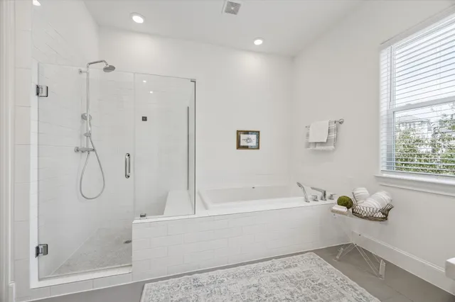a bathroom with a bath tub and a shower