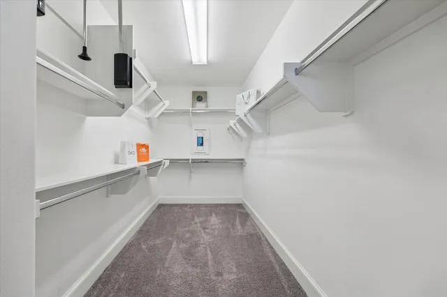 a view of storage and utility room with racks on the wall