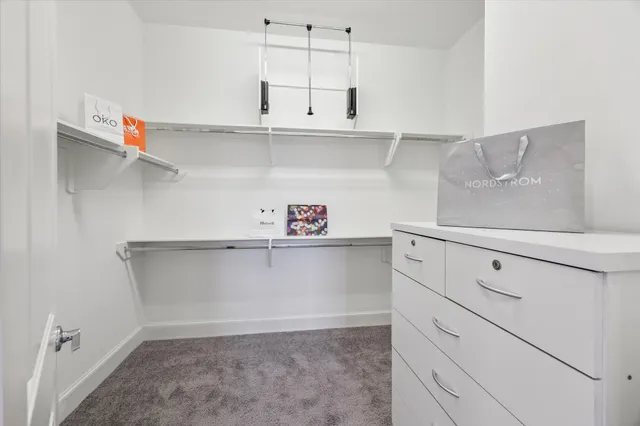 a bedroom with a bed and a table