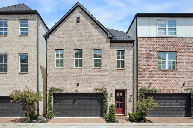 a front view of a house with garage