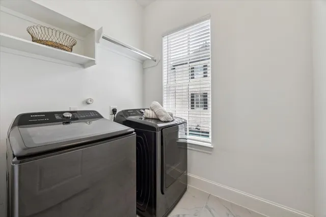 a view of a livingroom with a ceiling fan and window