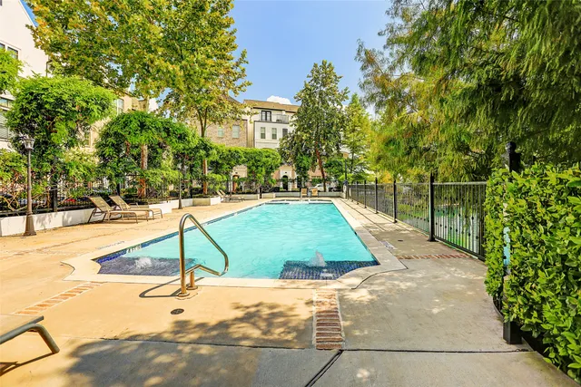 a view of a swimming pool with a patio