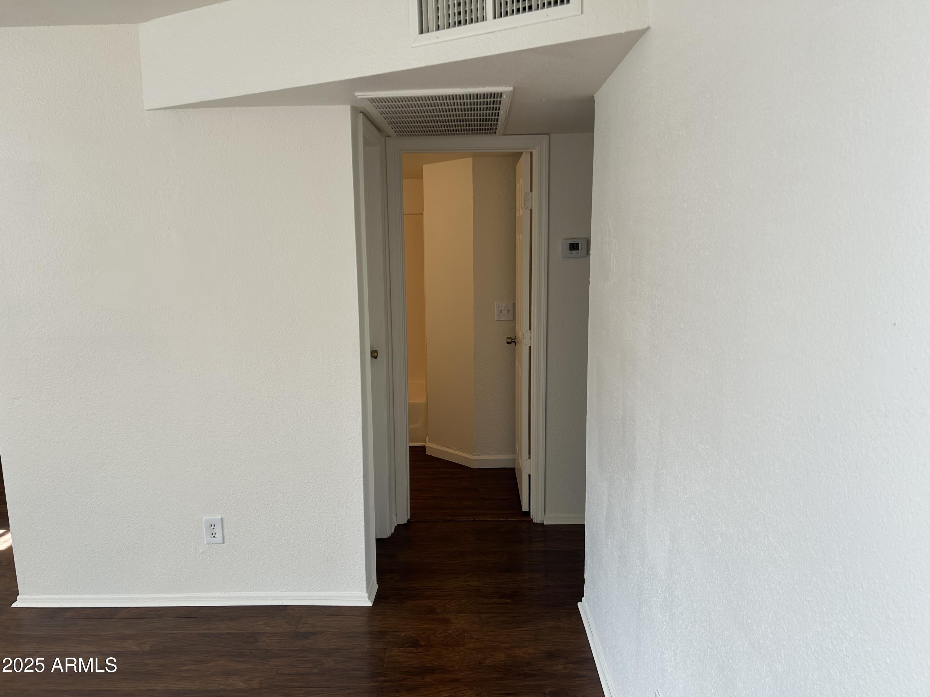 45 North Phyllis, Unit 109 Mesa, AZ 85201 - Photo 14 of 28 a view of a hallway with wooden floor