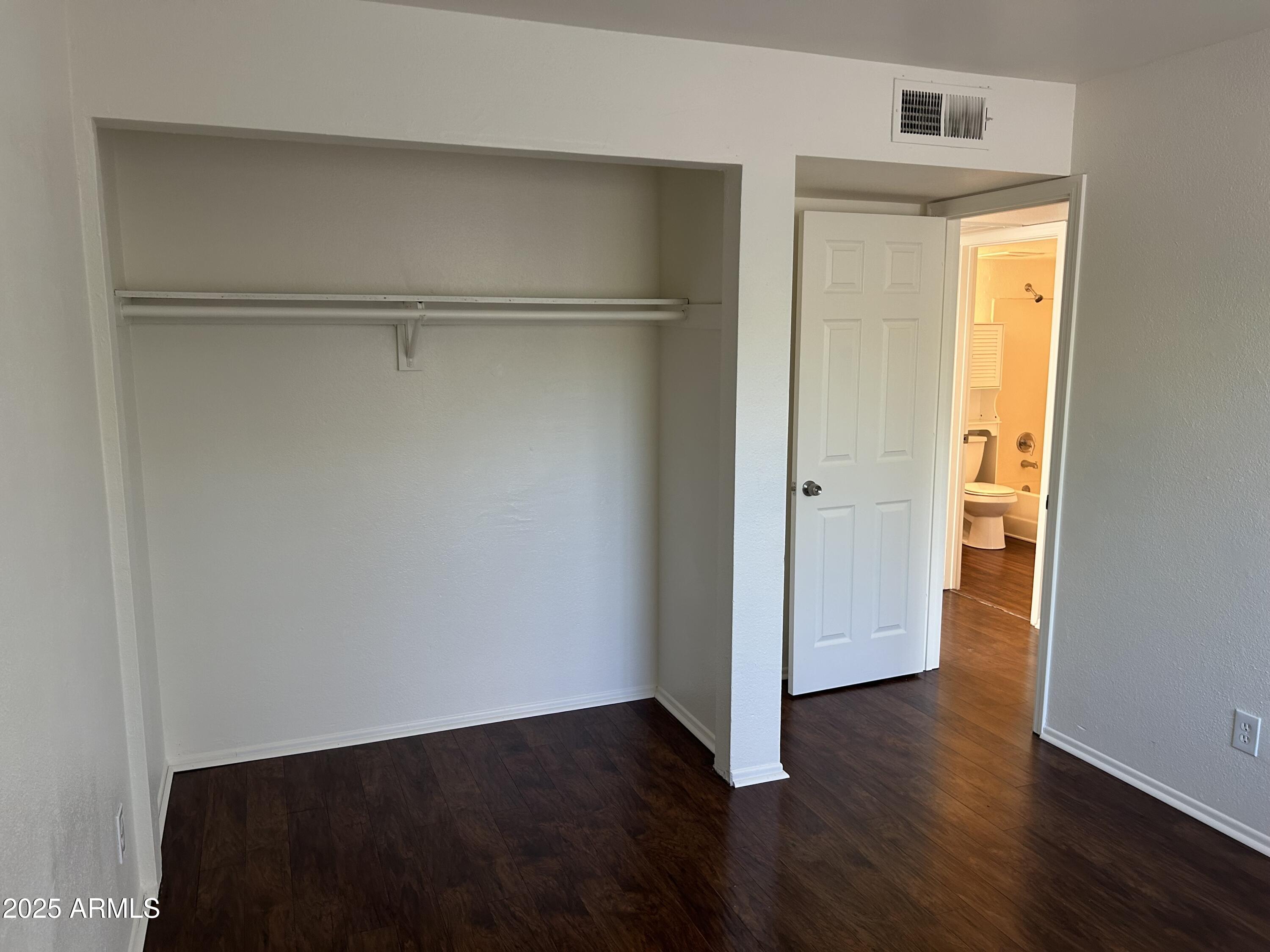 45 North Phyllis, Unit 109 Mesa, AZ 85201 - Photo 16 of 28 a view of an empty room with wooden floor