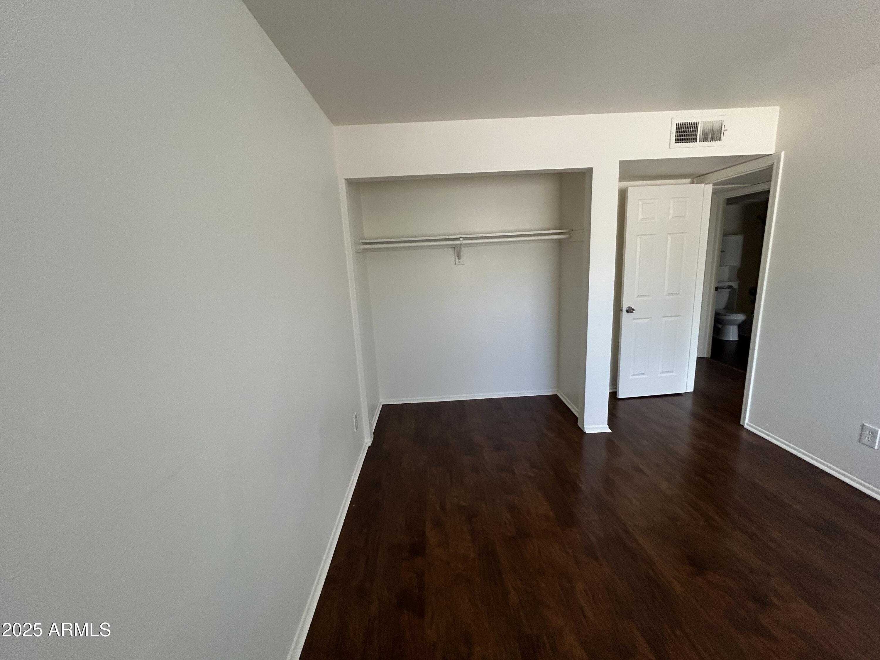 45 North Phyllis, Unit 109 Mesa, AZ 85201 - Photo 17 of 28 a view of a hallway with wooden floor