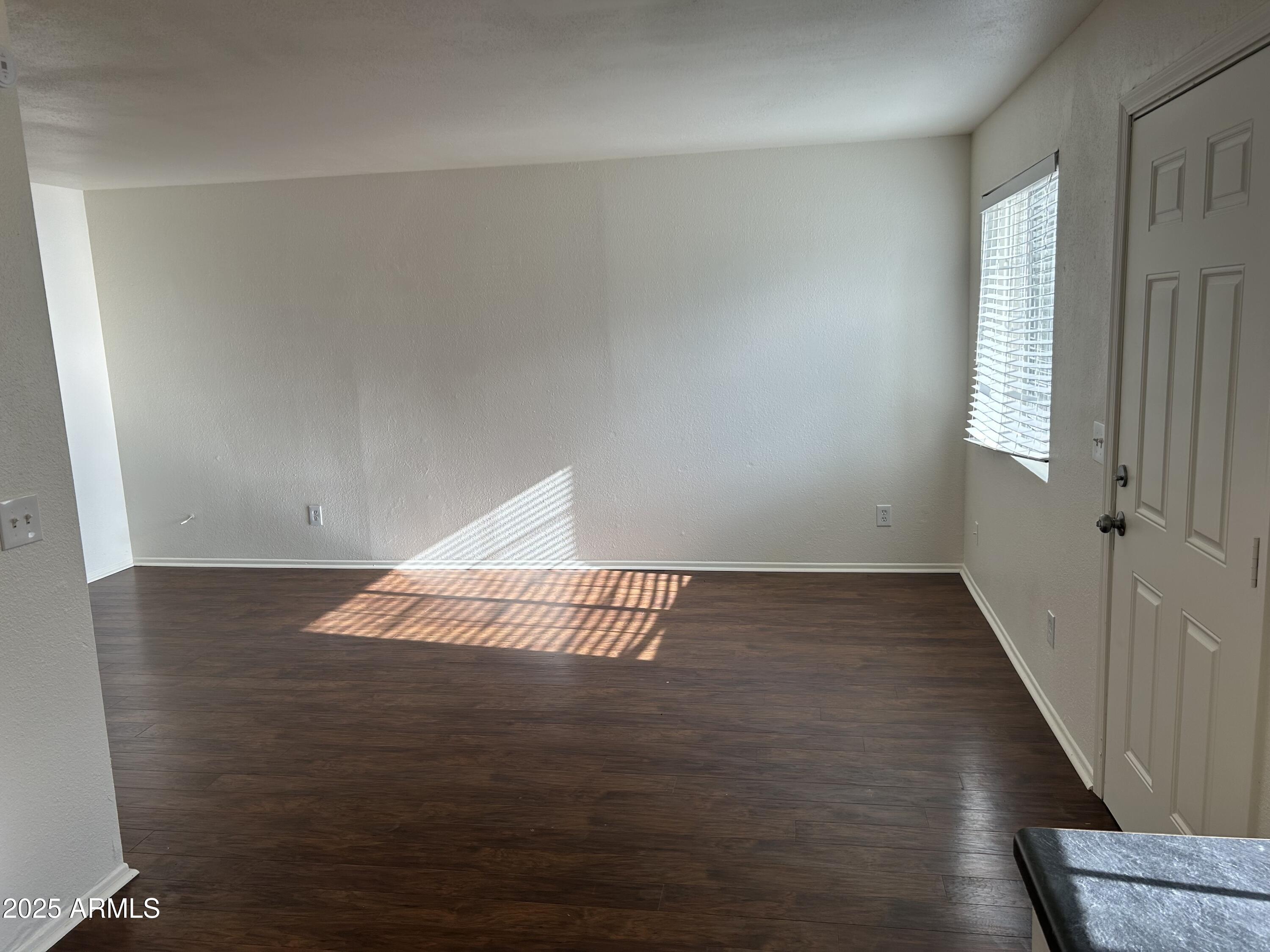45 North Phyllis, Unit 109 Mesa, AZ 85201 - Photo 6 of 28 a view of an empty room and window