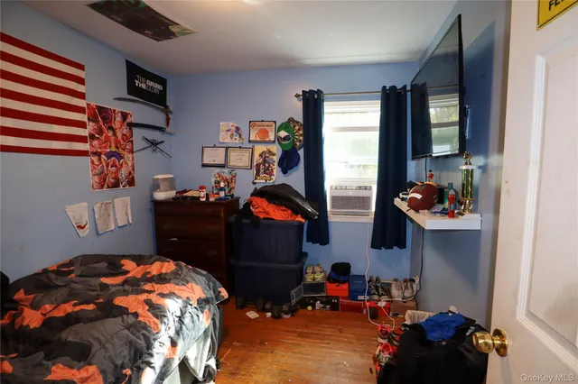 a bedroom with two beds and a window