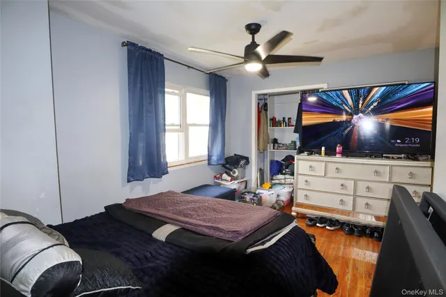 a room with a bed and a chandelier