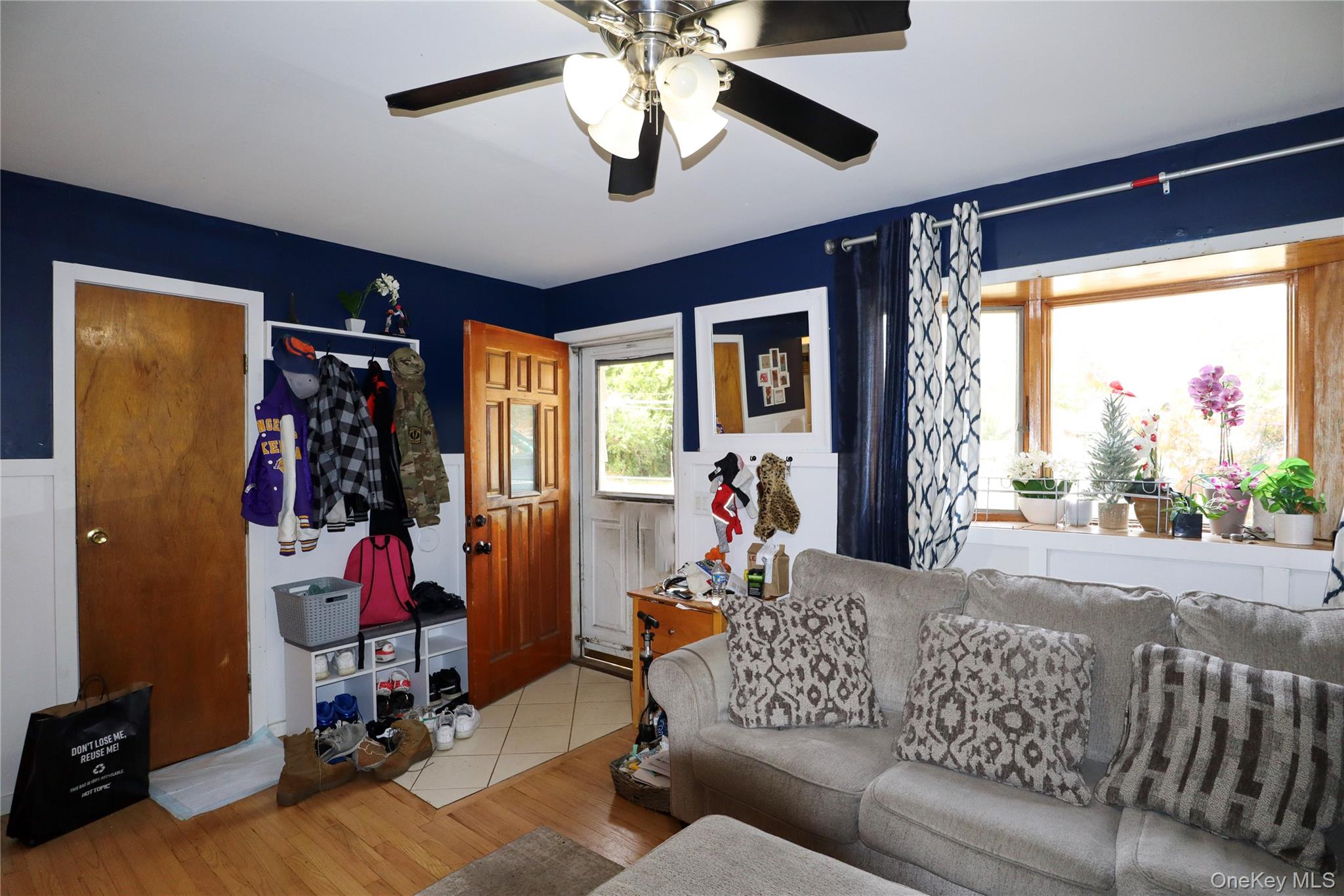 143 Jefferson Avenue Wyandanch, NY 11704 - Photo 2 of 37 a living room with furniture and a large window
