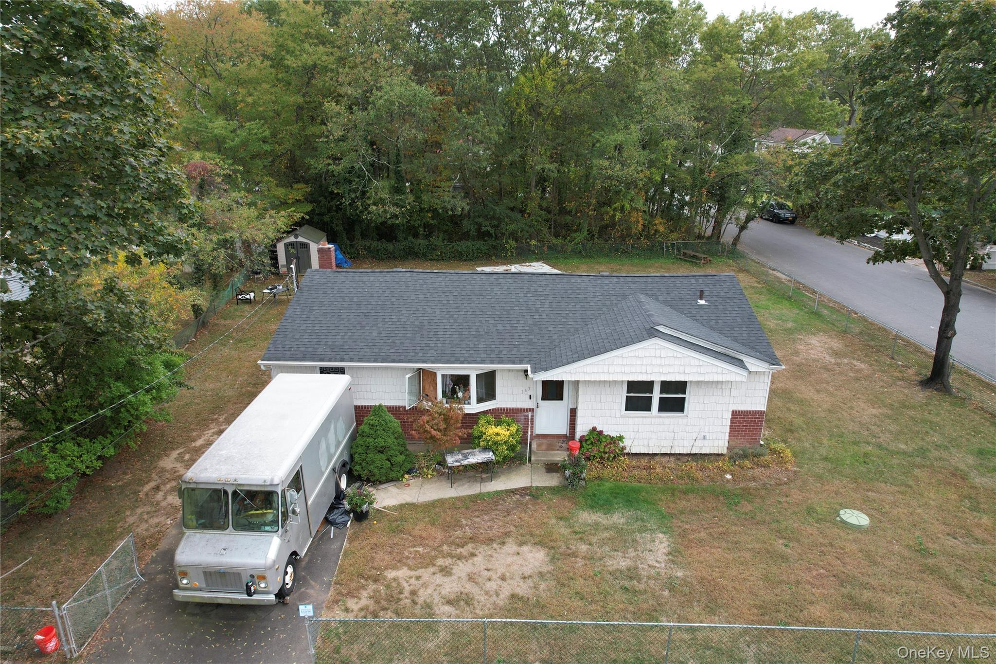 143 Jefferson Avenue Wyandanch, NY 11704 - Photo 28 of 37 an aerial view of a house with a yard