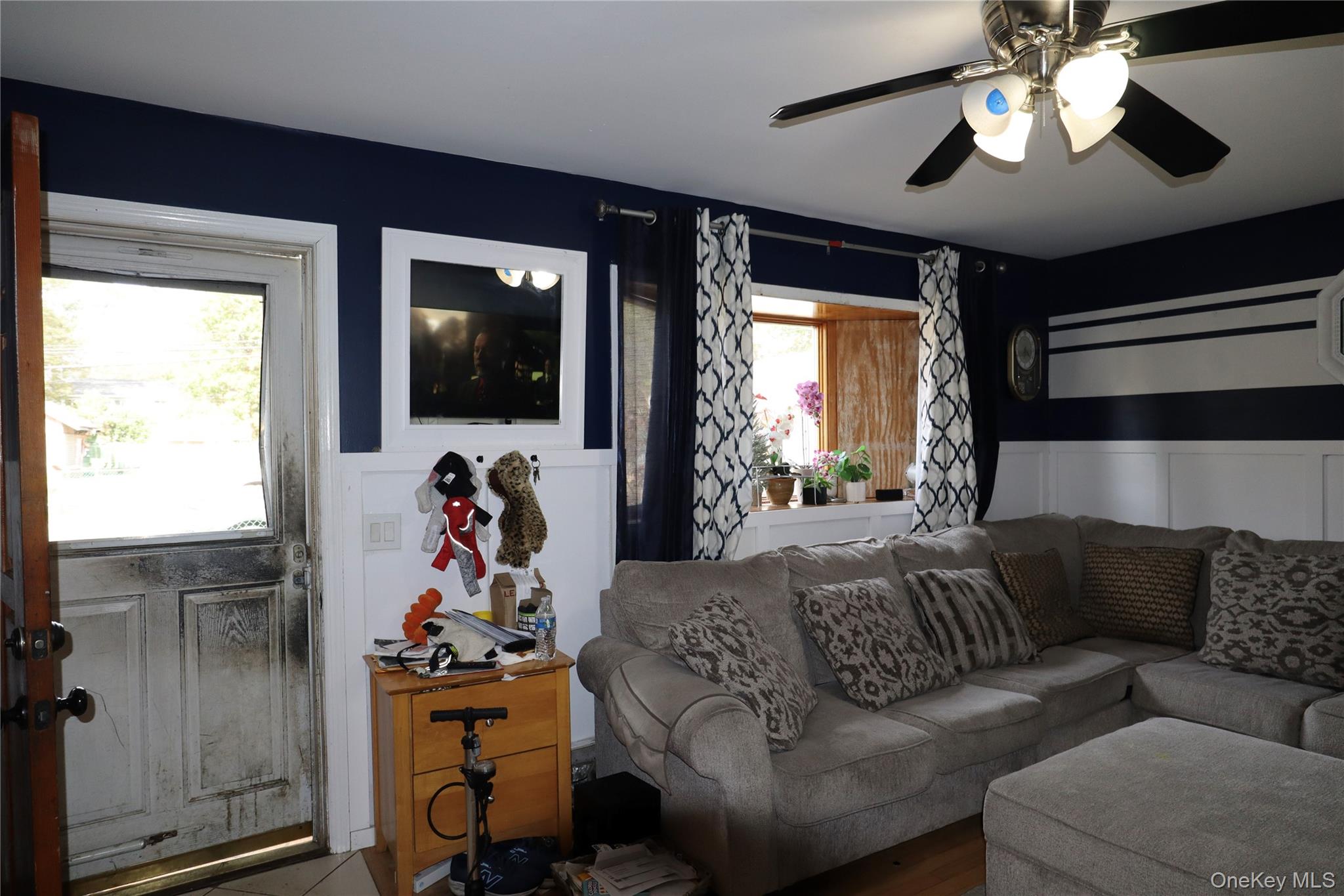 143 Jefferson Avenue Wyandanch, NY 11704 - Photo 4 of 37 a living room with furniture and a flat screen tv