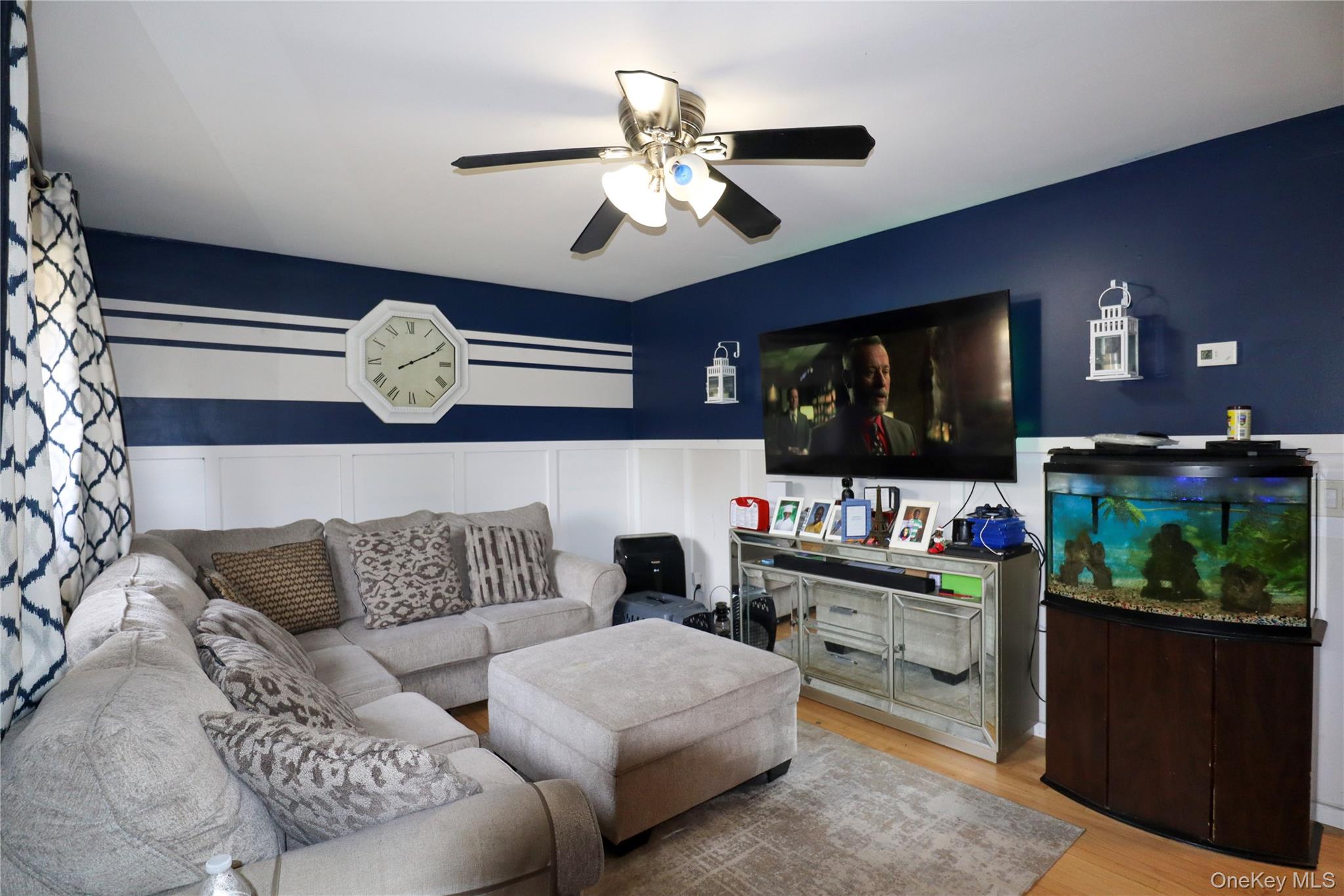 143 Jefferson Avenue Wyandanch, NY 11704 - Photo 5 of 37 a living room with furniture and a flat screen tv
