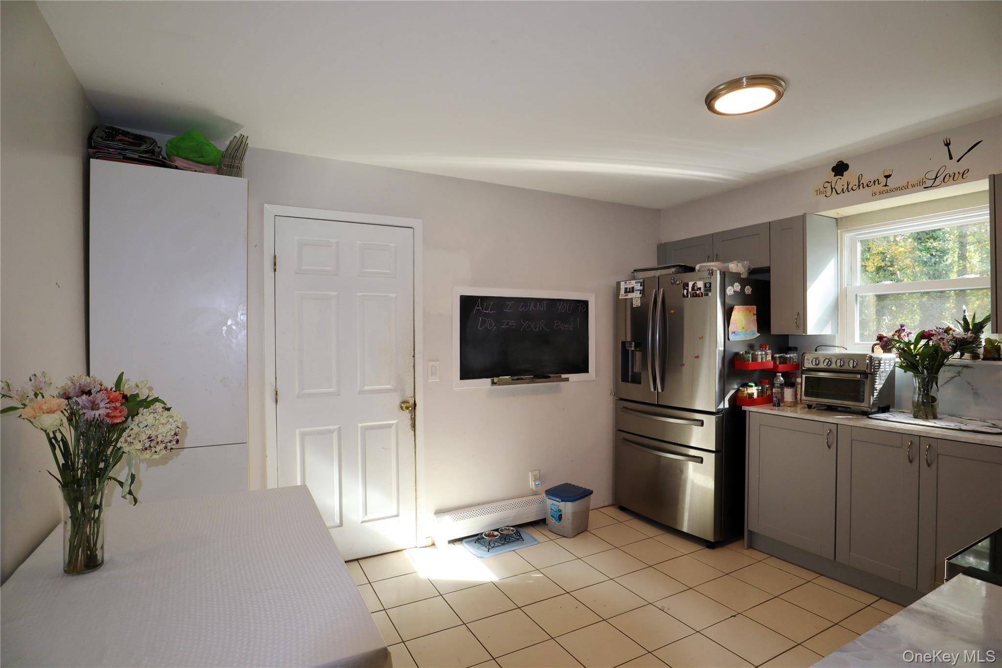 143 Jefferson Avenue Wyandanch, NY 11704 - Photo 10 of 37 a kitchen with a refrigerator and a sink