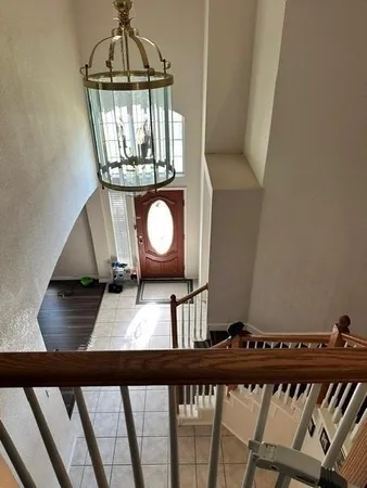 a view of a living room and wooden floor