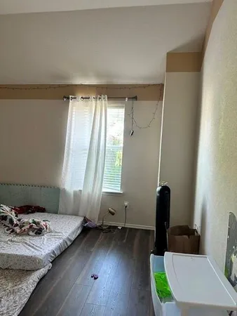 a view of bathroom with a sink toilet and a window