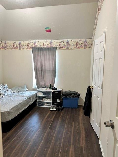 8113 Spring Peaks Drive Plano, TX 75025 - Photo 6 of 9 a bedroom with a bed and a window