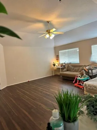 a bedroom with furniture and a chandelier