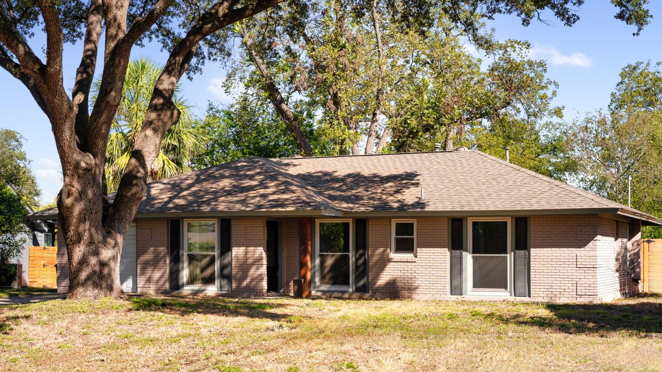 2118 Fordham Lane Austin, TX 78723 - Photo 5 of 28 a front view of a house with a yard