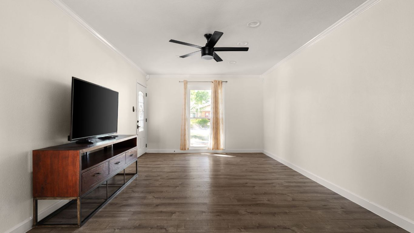 2118 Fordham Lane Austin, TX 78723 - Photo 7 of 28 a living room with flat screen tv and windows