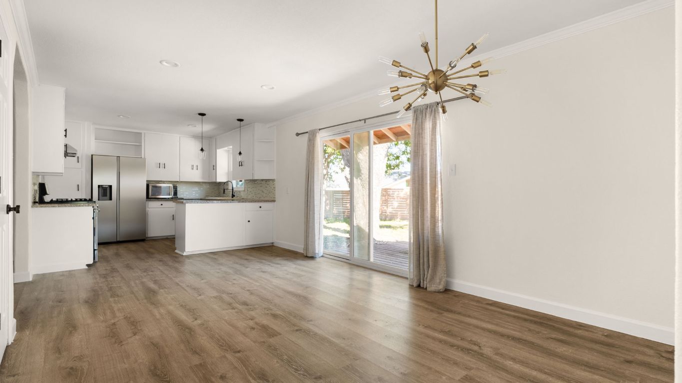 2118 Fordham Lane Austin, TX 78723 - Photo 9 of 28 a view of a kitchen with a sink cabinets and wooden floor