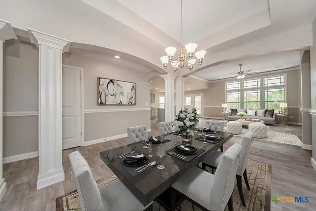 a living room with furniture flat screen tv and a fireplace