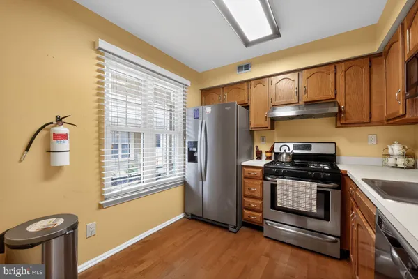 a view of a livingroom with wooden floor and a window