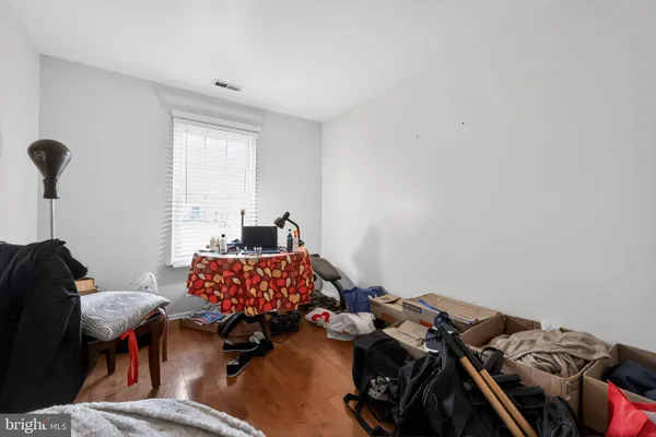 a bedroom with a bed and a closet
