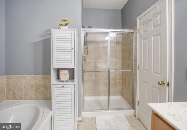 a living room with furniture a flat screen tv and a large window