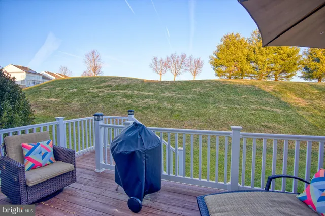 a view of balcony with wooden floor and fence
