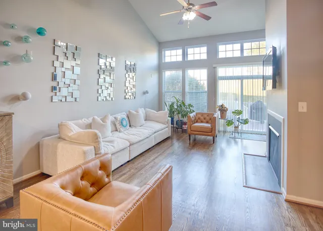 a view of walk in closet with clothes