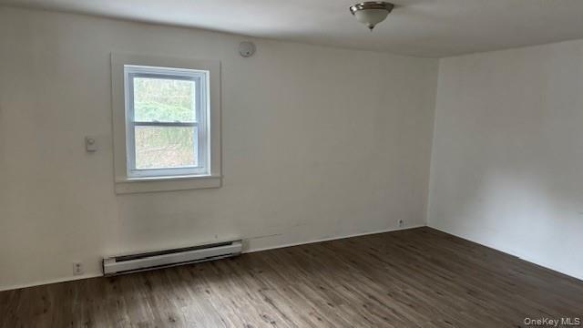 278 Cold Spring Road, Unit 3 Monticello, NY 12701 - Photo 2 of 4 an empty room with a hardwood and a window