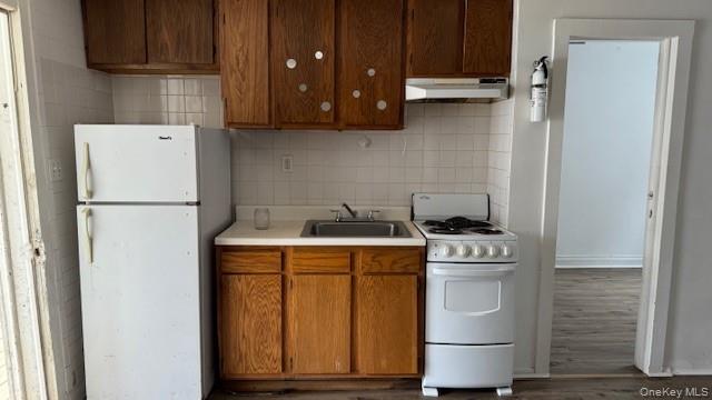 278 Cold Spring Road, Unit 3 Monticello, NY 12701 - Photo 4 of 4 a kitchen with a refrigerator and a stove