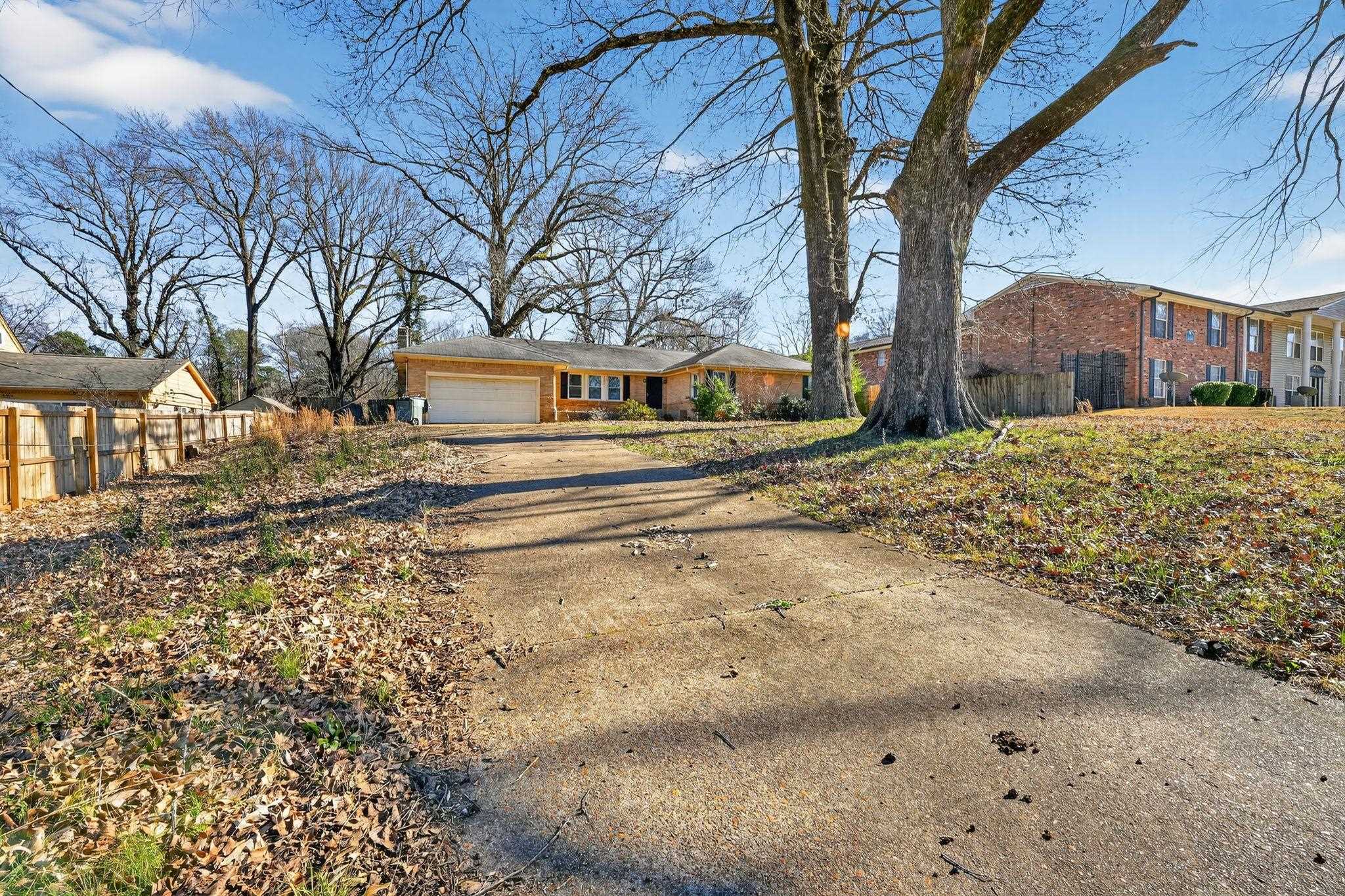 4094 Auburn Road Memphis, TN 38116 - Photo 22 of 30 View of front of property with concrete driveway, a garage, and brick siding