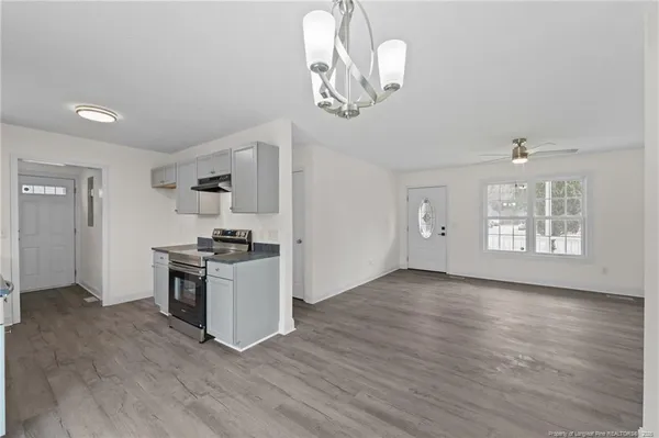 a kitchen with stainless steel appliances granite countertop a stove and a sink