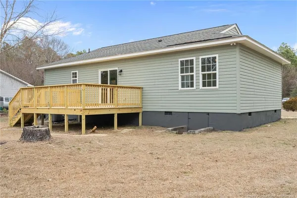 a view of deck with a large trees