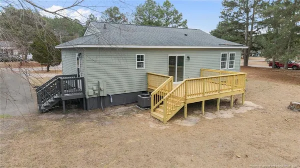 a view of a hardwood floor and dining room