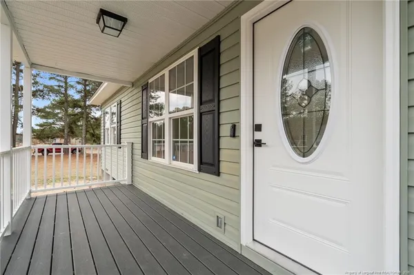 a view of a balcony with wooden floor