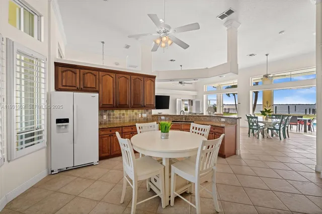 a view of a livingroom with furniture and a flat screen tv