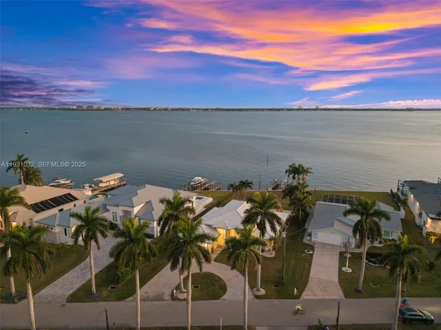a view of a house with swimming pool yard and sitting area